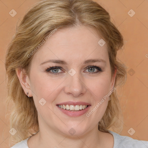 Joyful white young-adult female with medium  brown hair and blue eyes