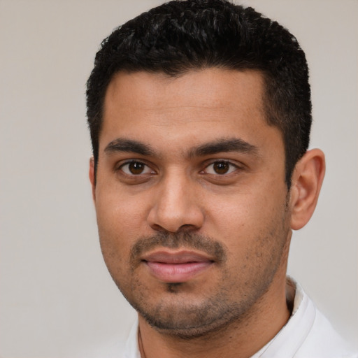 Neutral latino young-adult male with short  black hair and brown eyes