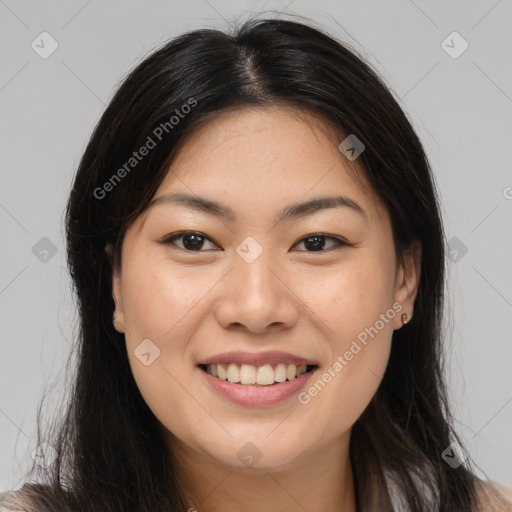 Joyful asian young-adult female with long  brown hair and brown eyes