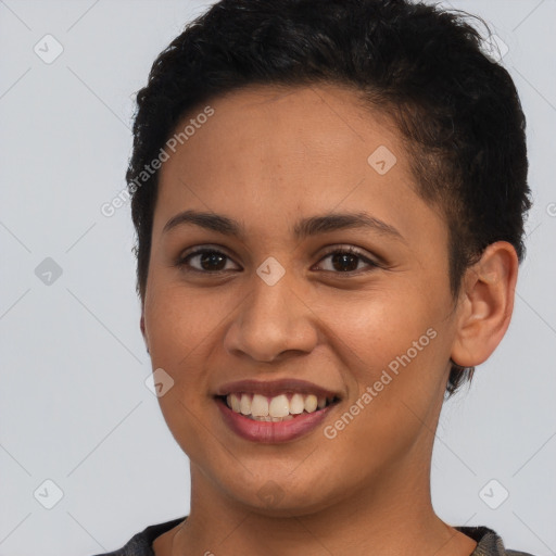 Joyful latino young-adult female with short  brown hair and brown eyes