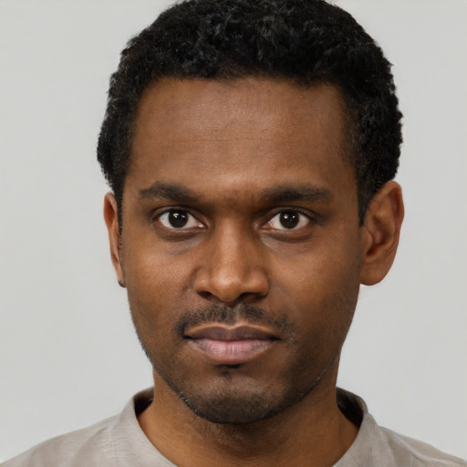 Neutral black young-adult male with short  black hair and brown eyes