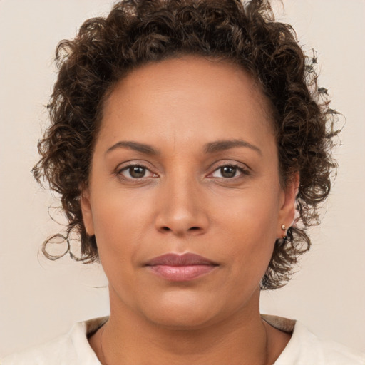 Neutral white young-adult female with short  brown hair and brown eyes