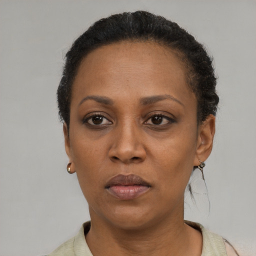 Neutral black adult female with short  black hair and brown eyes