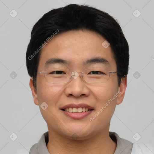 Joyful asian young-adult male with short  black hair and brown eyes