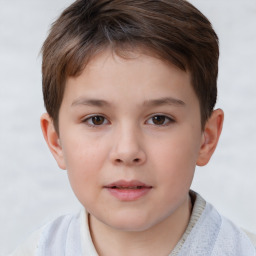 Joyful white child male with short  brown hair and brown eyes