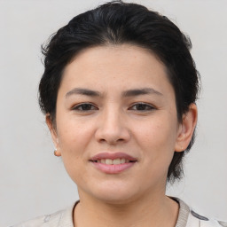 Joyful asian young-adult female with medium  brown hair and brown eyes