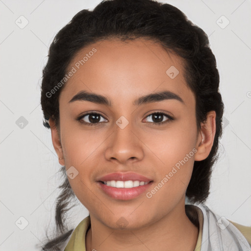 Joyful latino young-adult female with long  black hair and brown eyes