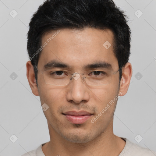 Joyful asian young-adult male with short  black hair and brown eyes