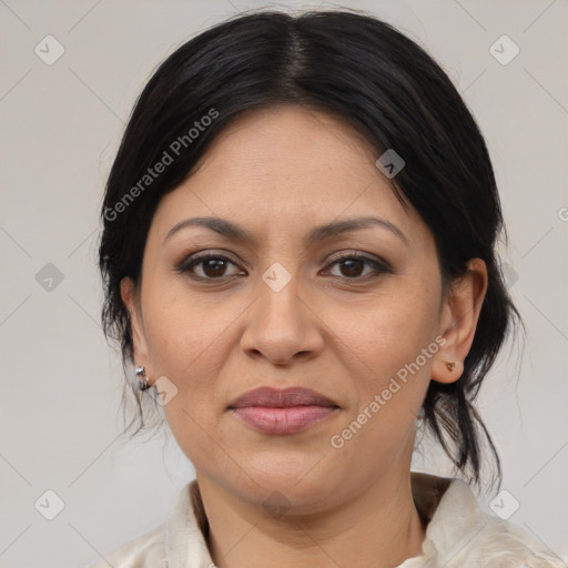 Joyful latino adult female with medium  brown hair and brown eyes