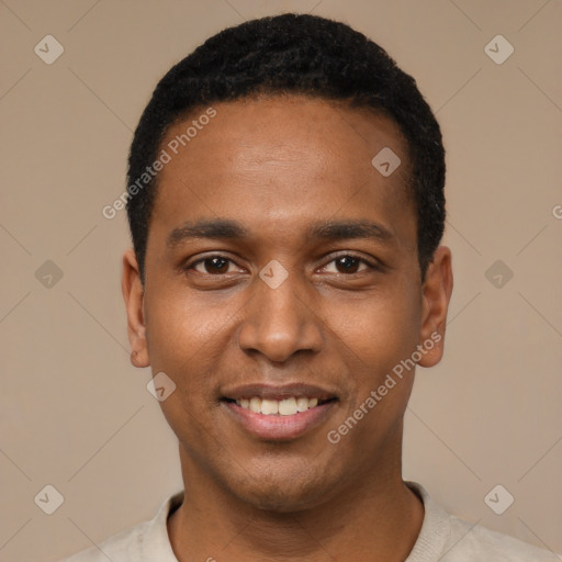 Joyful black young-adult male with short  black hair and brown eyes