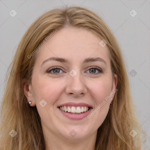 Joyful white young-adult female with long  brown hair and grey eyes