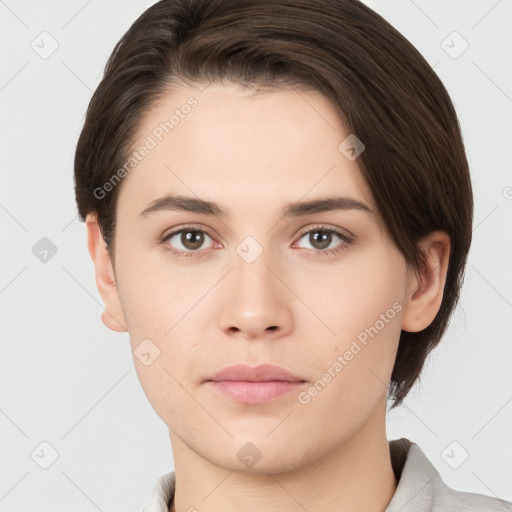 Neutral white young-adult female with short  brown hair and brown eyes