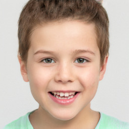 Joyful white child male with short  brown hair and brown eyes