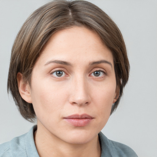 Neutral white young-adult female with medium  brown hair and grey eyes