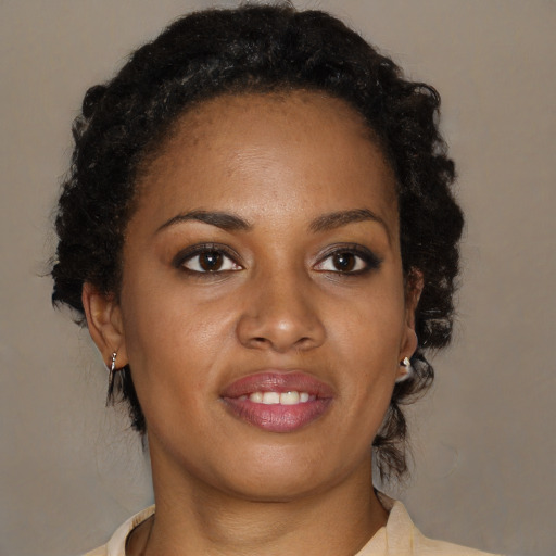 Joyful black young-adult female with medium  brown hair and brown eyes