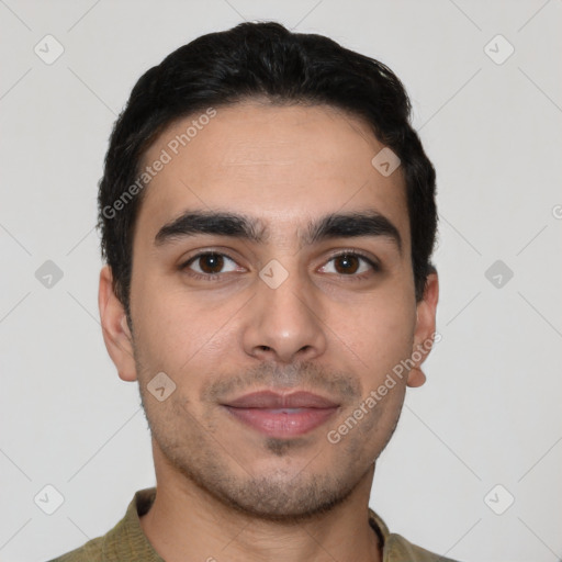 Joyful latino young-adult male with short  black hair and brown eyes