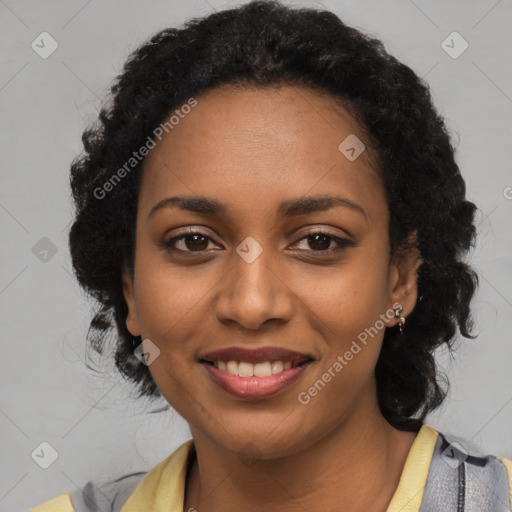 Joyful black young-adult female with long  black hair and brown eyes