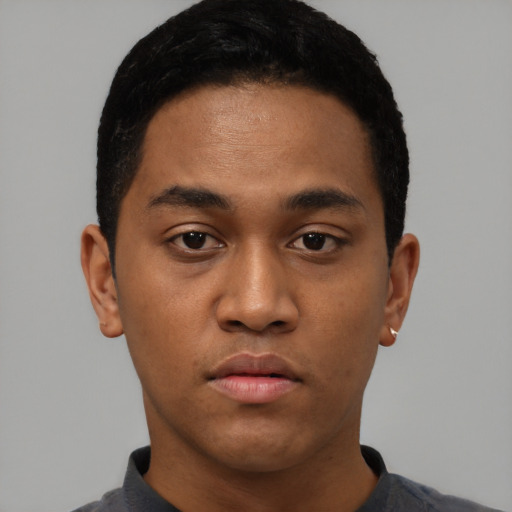 Neutral latino young-adult male with short  black hair and brown eyes