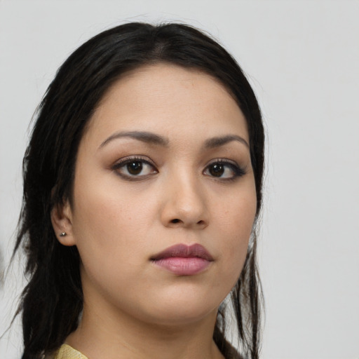 Neutral latino young-adult female with long  brown hair and brown eyes