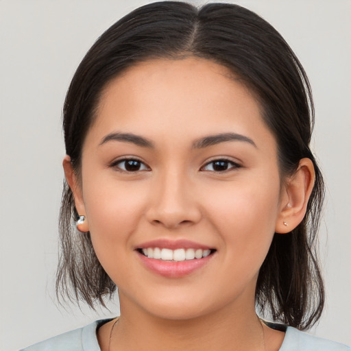 Joyful white young-adult female with medium  brown hair and brown eyes