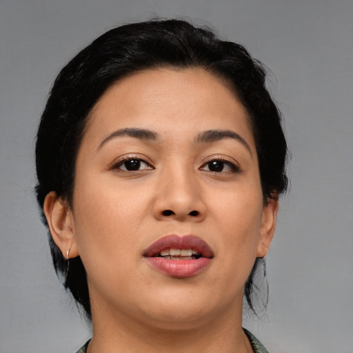 Joyful asian young-adult female with medium  brown hair and brown eyes