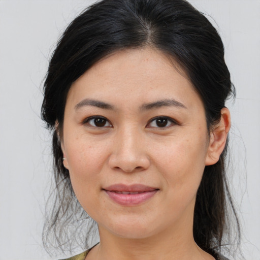 Joyful asian young-adult female with medium  brown hair and brown eyes