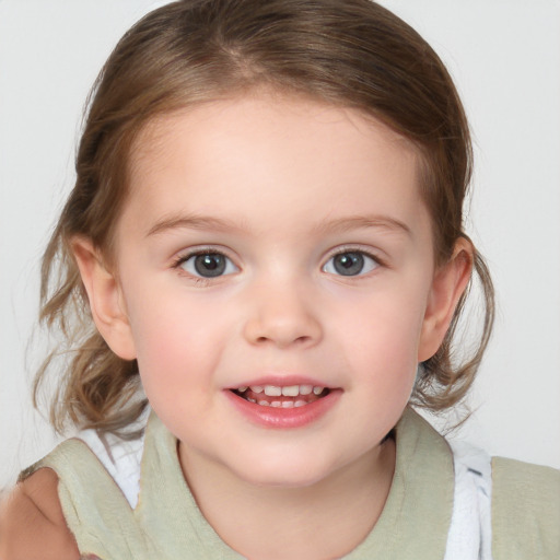 Joyful white child female with medium  brown hair and blue eyes