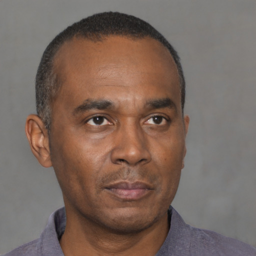 Neutral black adult male with short  brown hair and brown eyes