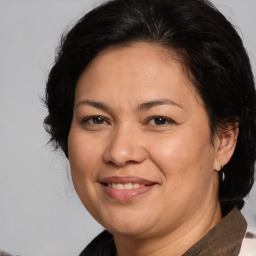 Joyful white adult female with medium  brown hair and brown eyes