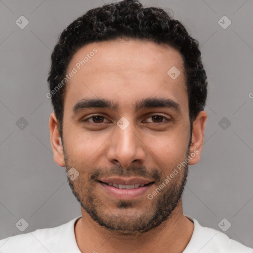 Joyful white young-adult male with short  black hair and brown eyes