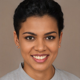 Joyful latino young-adult female with short  brown hair and brown eyes