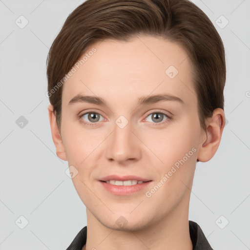 Joyful white young-adult female with short  brown hair and grey eyes