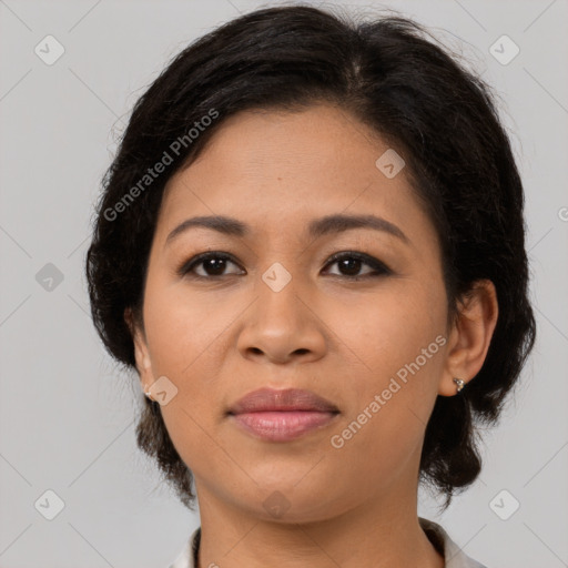 Joyful latino young-adult female with medium  brown hair and brown eyes