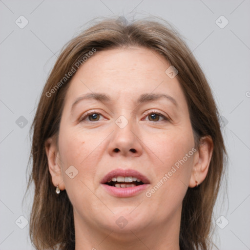 Joyful white adult female with medium  brown hair and grey eyes