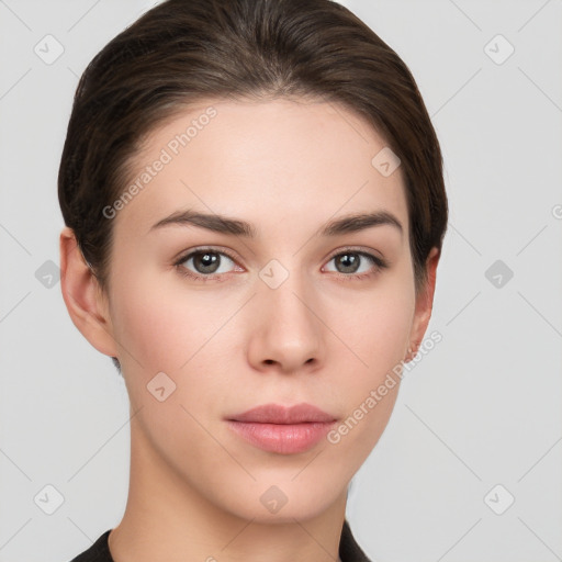 Neutral white young-adult female with short  brown hair and brown eyes