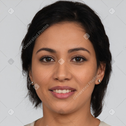 Joyful latino young-adult female with medium  brown hair and brown eyes