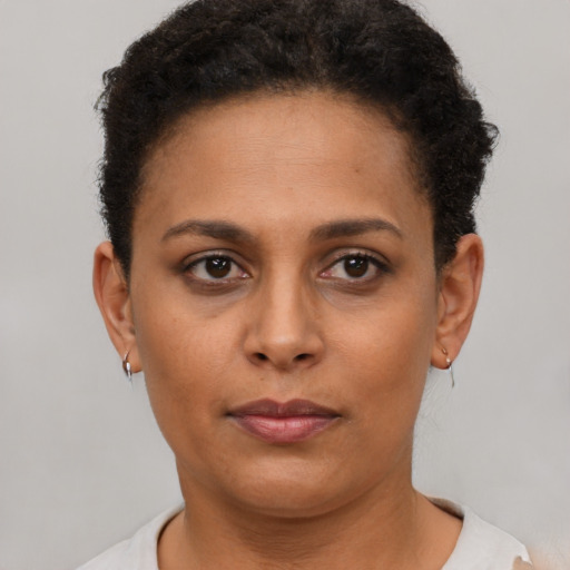 Neutral black young-adult female with short  brown hair and brown eyes