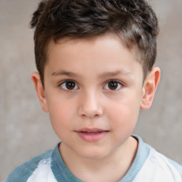 Joyful white child male with short  brown hair and brown eyes