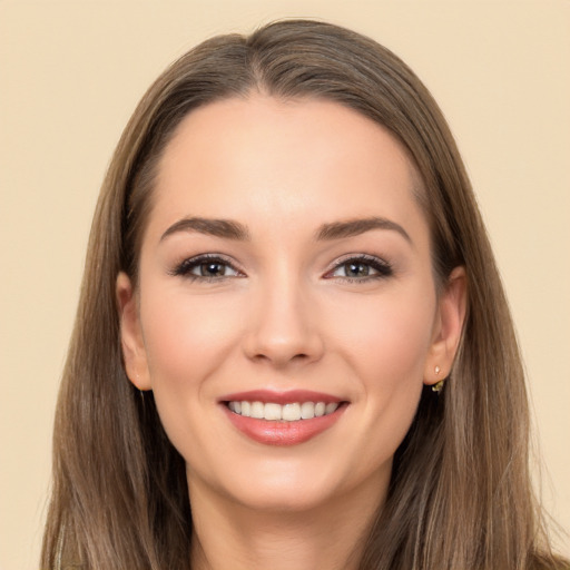 Joyful white young-adult female with long  brown hair and brown eyes