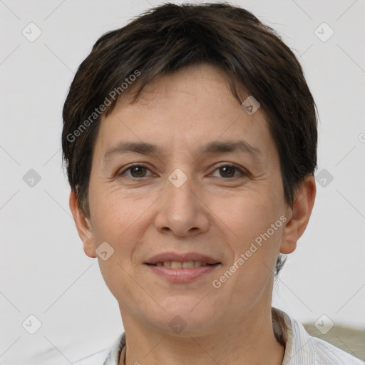 Joyful white adult female with short  brown hair and brown eyes