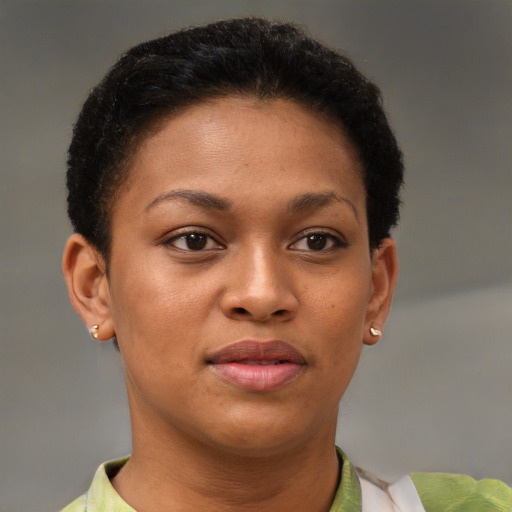 Joyful black young-adult female with short  brown hair and brown eyes