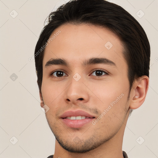 Joyful white young-adult male with short  black hair and brown eyes