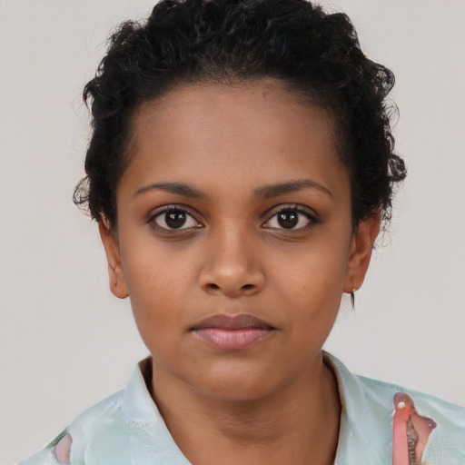 Neutral black child female with short  brown hair and brown eyes