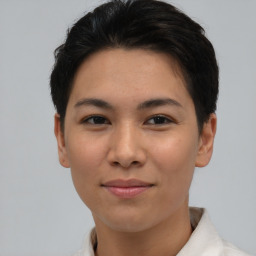 Joyful asian young-adult female with short  brown hair and brown eyes