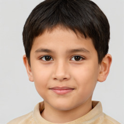 Joyful white child male with short  brown hair and brown eyes