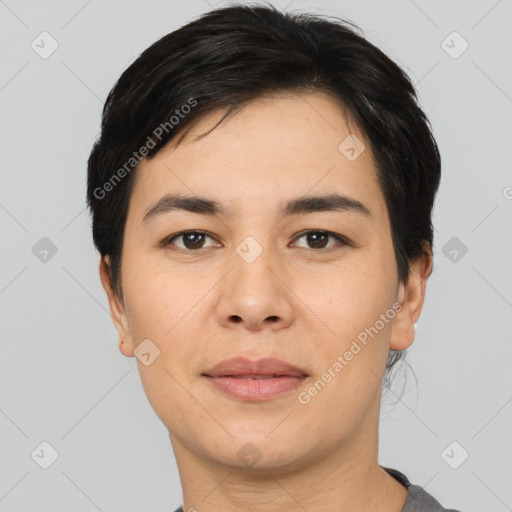 Joyful asian young-adult female with short  black hair and brown eyes