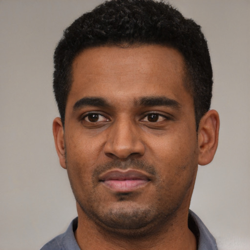 Neutral black young-adult male with short  black hair and brown eyes