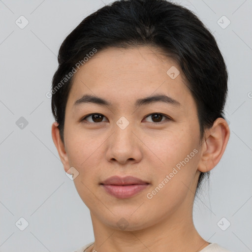 Joyful asian young-adult female with short  brown hair and brown eyes