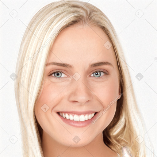 Joyful white young-adult female with long  blond hair and blue eyes