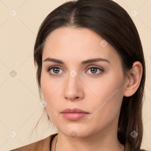 Neutral white young-adult female with long  brown hair and brown eyes